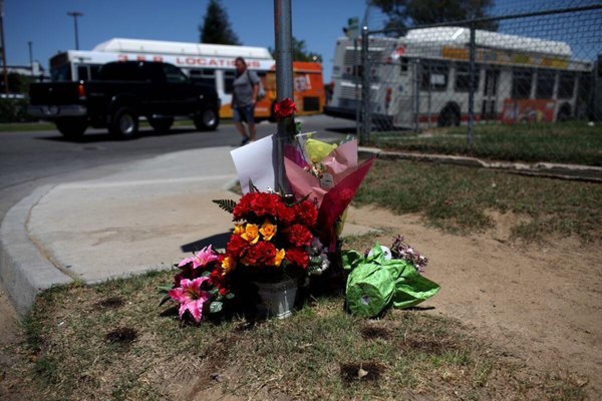 A makeshift memorial for David Sal Silva set up on an East Bakersfield street corner in 2013.