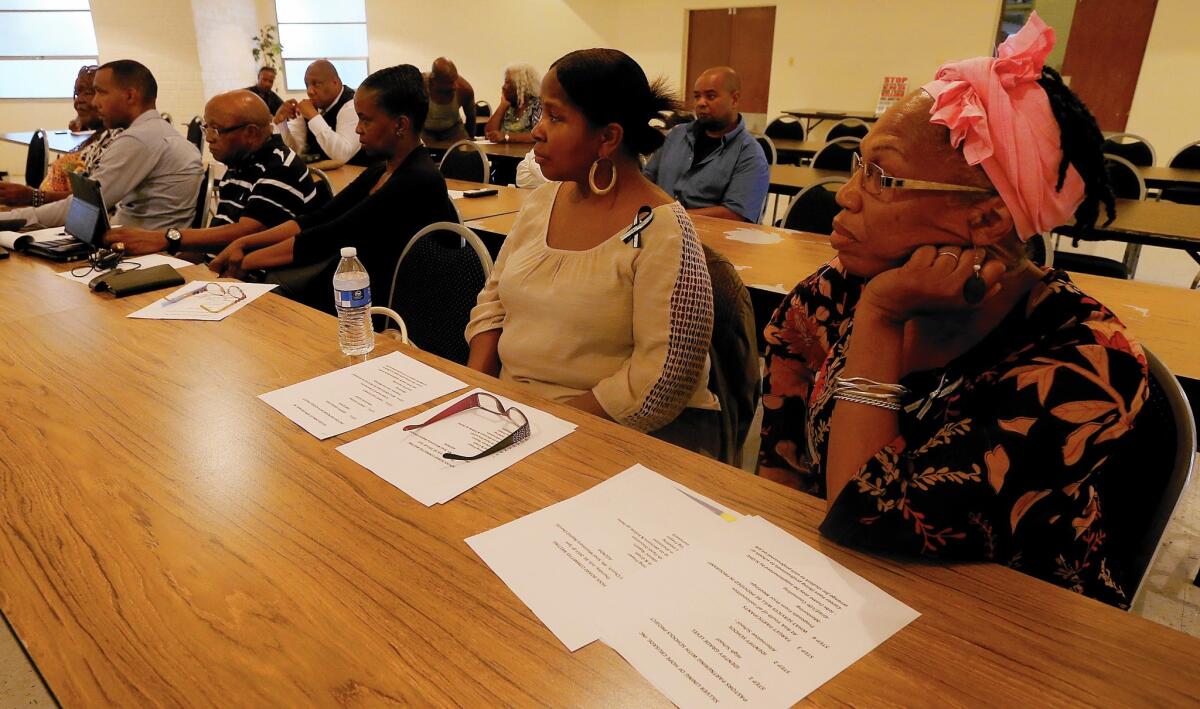 Pastors and other community members meet Thursday at Mount Sinai Missionary Baptist Church in Los Angeles to respond to concerns about gang violence.