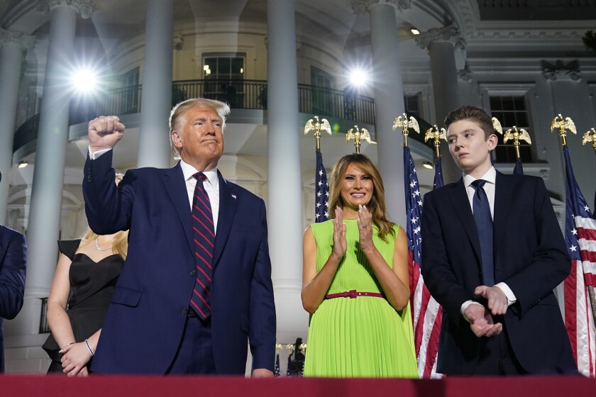 President Donald Trump, first lady Melania Trump and Barron Trump stand on the South Lawn of the White House on the fourth day of the Republican National Convention, Thursday, Aug. 27, 2020, in Washington. It's called a “permission structure.” President Donald Trump's campaign is trying to construct an emotional and psychological gateway to help disenchanted voters feel comfortable voting for the president again despite their reservations about him personally. (AP Photo/Evan Vucci)