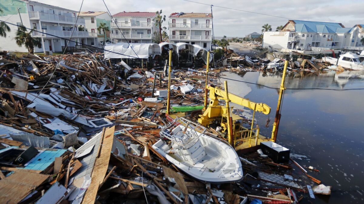 A boat sits among debris in the aftermath of Hurricane Michael in Mexico Beach, Fla.
