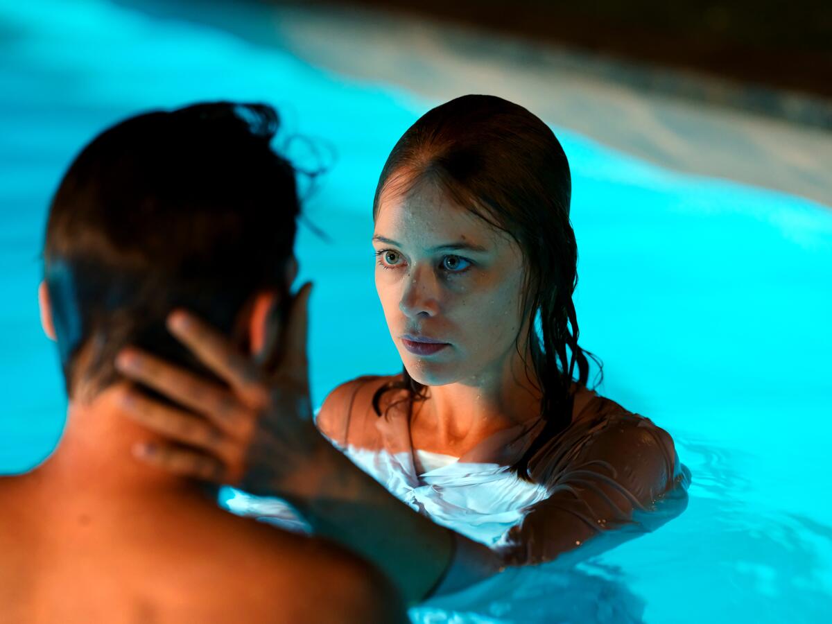 Jacob Matschenz and Paula Beer in a swimming pool in the 2020 drama “Undine.”
