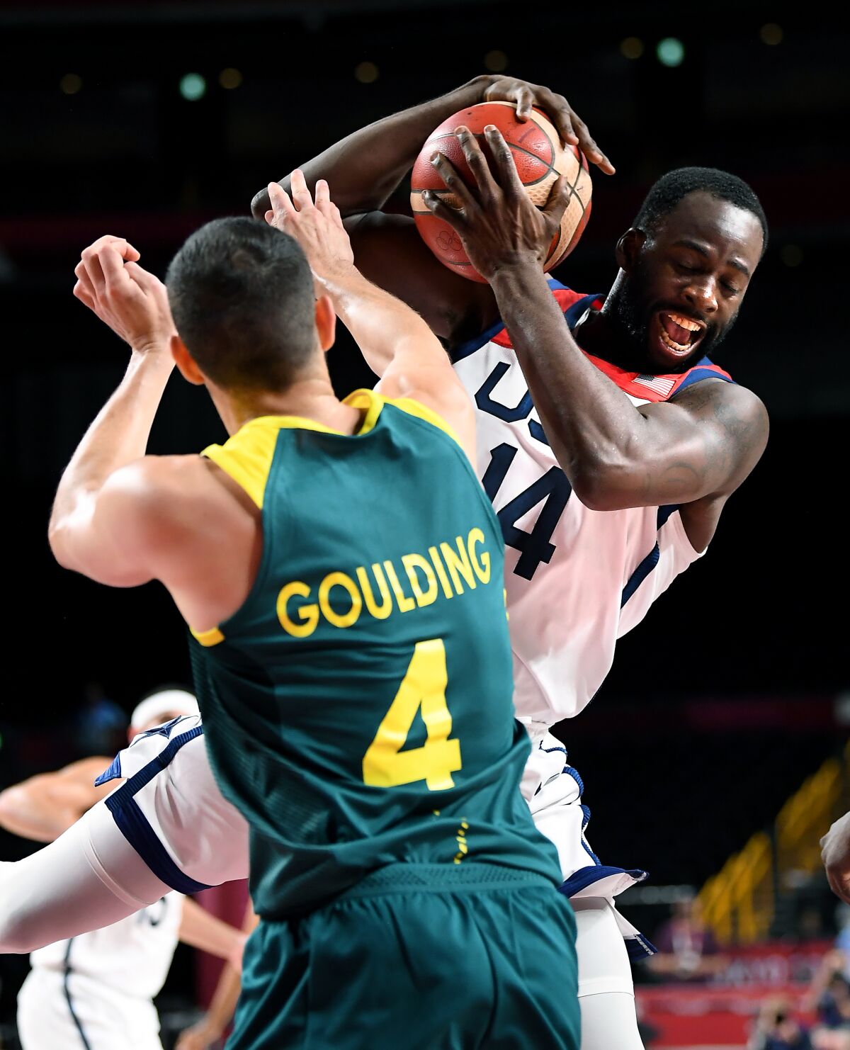 USA's Draymond Green grabs a rebound from Australia's Chris Goulding