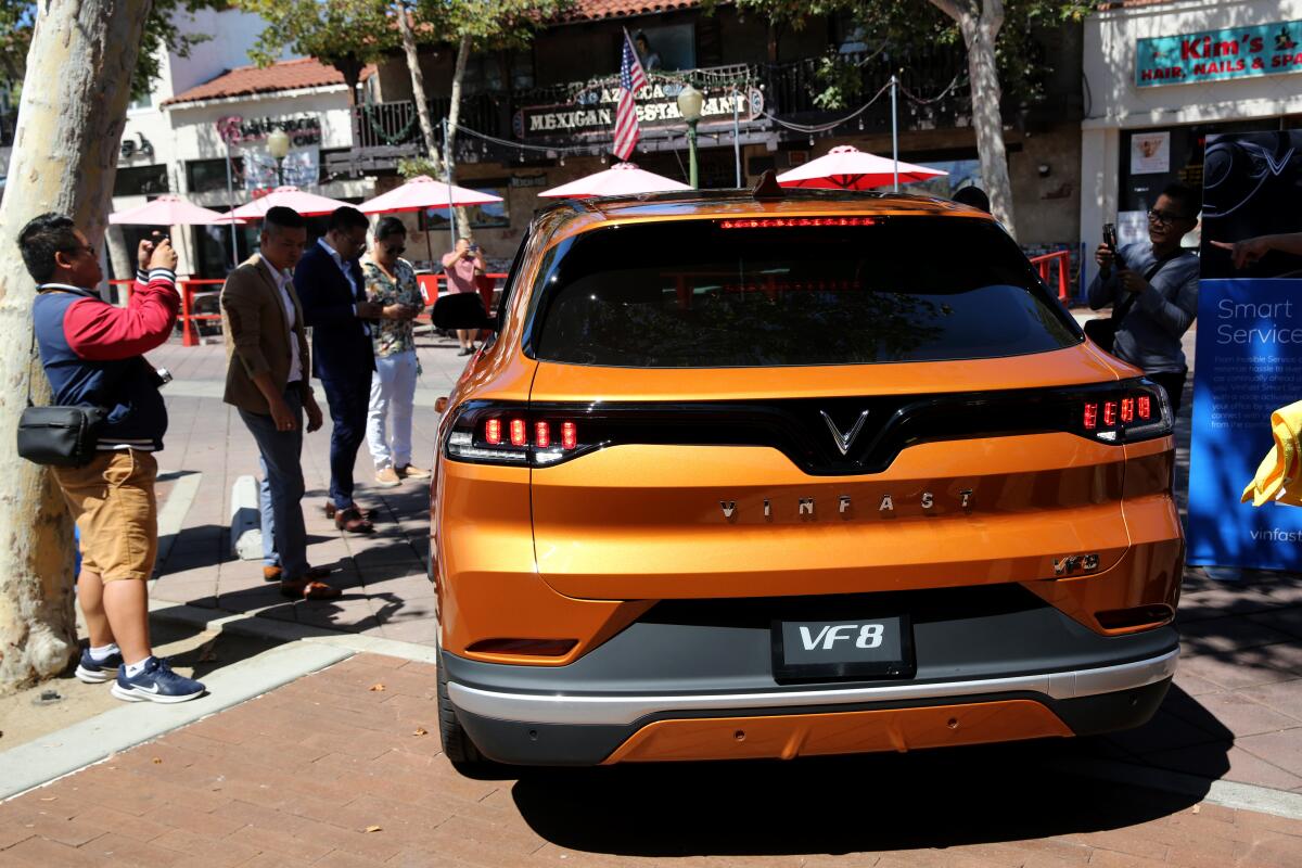 Potential customers and media get a first look at the VinFast VF8 electric SUV.