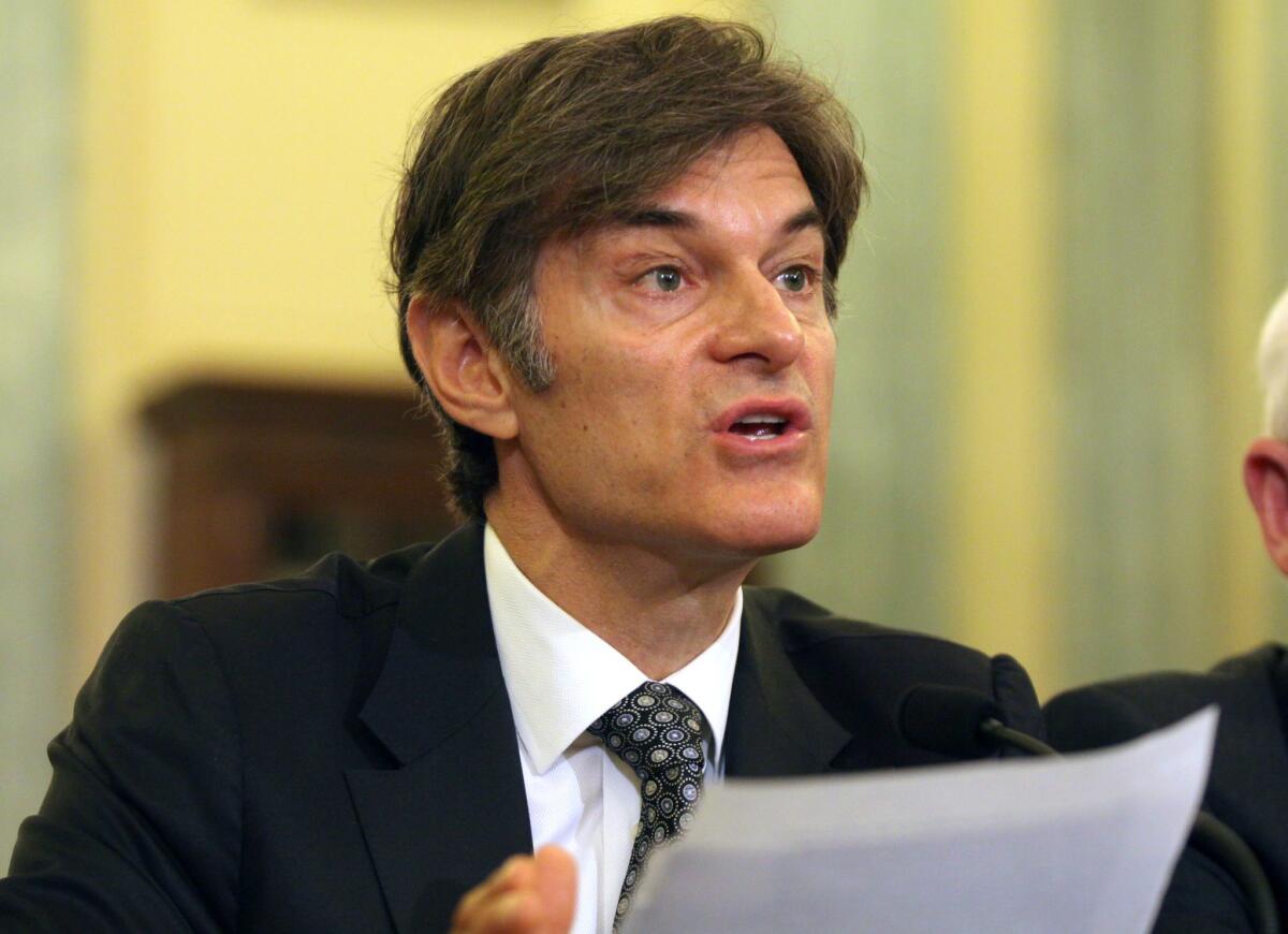 Dr. Mehmet Oz, vice chairman and professor of surgery, Columbia University College of Physicians and Surgeons, testifies on Capitol Hill in Washington. Ten top physicians want Columbia University to remove the celebrity doctor from his medical faculty position.