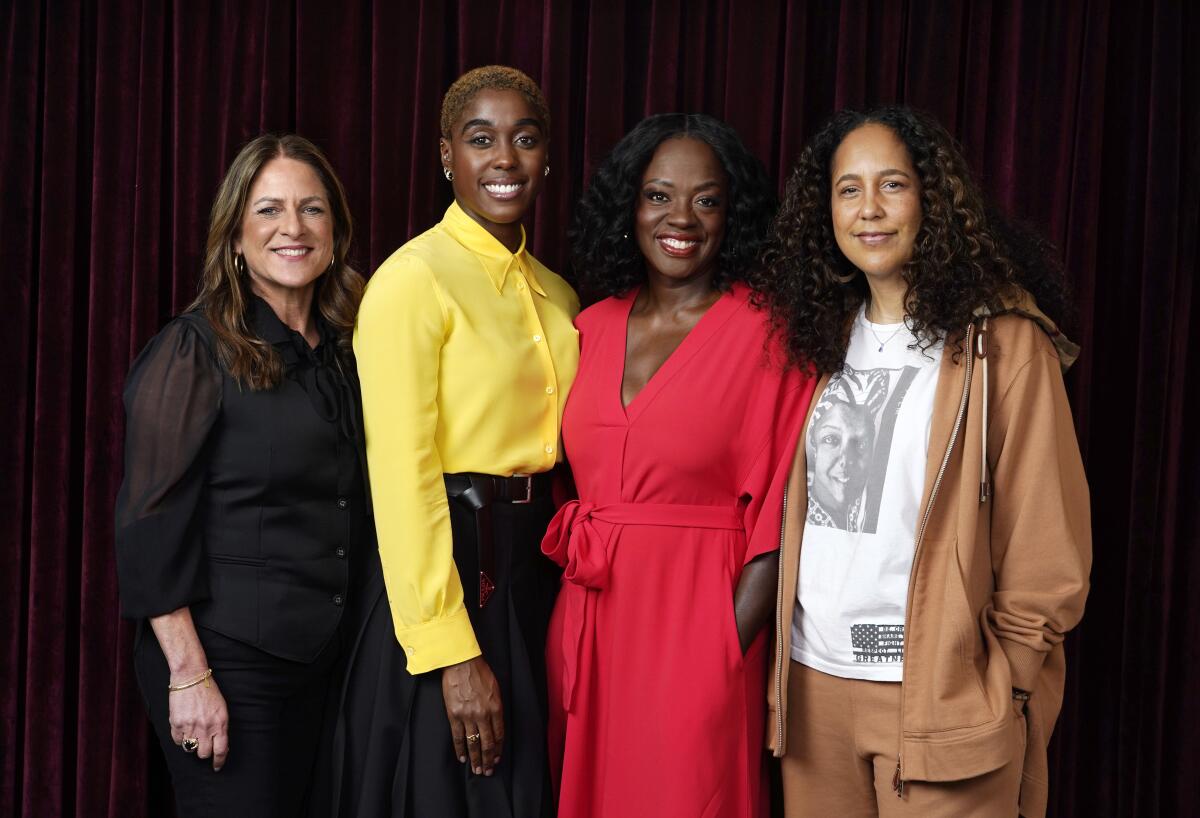 From left, Cathy Schulman, one of the producers of "The Woman King," cast members Lashana Lynch and Viola Davis, and director Gina Prince-Blythewood pose together for a portrait at the Ritz-Carlton Hotel, during the Toronto International Film Festival, Thursday, Sept. 8, 2022, in Toronto. (AP Photo/Chris Pizzello)