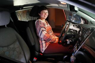 Erin Danzer, 18, of Oceanside sits inside her new car, which was adapted for her special needs by the Make-A-Wish Foundation in San Diego and Golden Boy Mobility in Poway. Danzer has a connective tissue disease that makes it impossible to drive the car her parents bought for her.