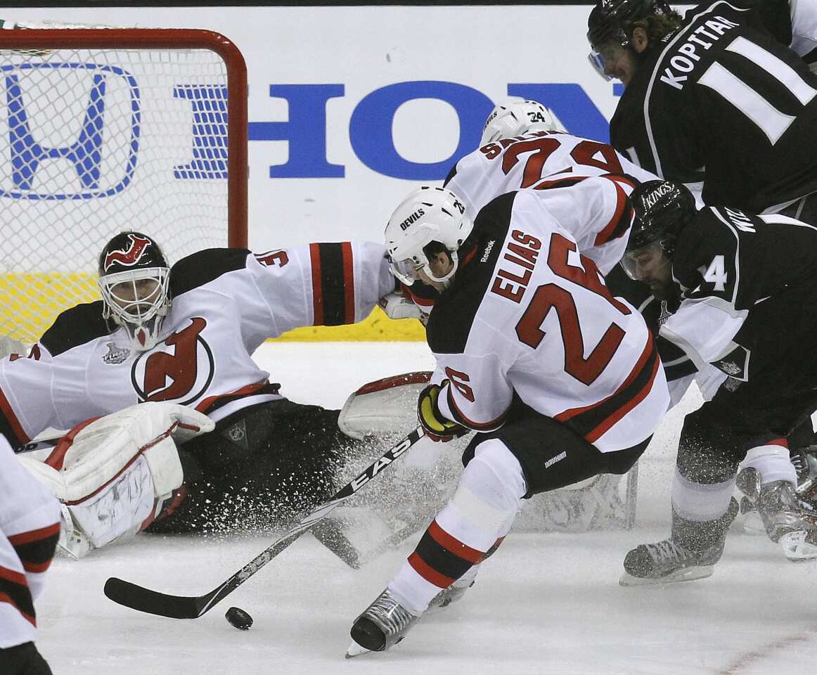 New Jersey forward Patrik Elias clears the puck away from goalie Martin Brodeur in the first period of the Kings' 4-0 victory in Game 3 of the Stanley Cup Final at Staples Center.