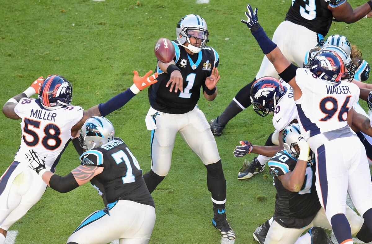 Panthers quarterback Cam Newton (1) throws a pass against the Broncos during Super Bowl 50.
