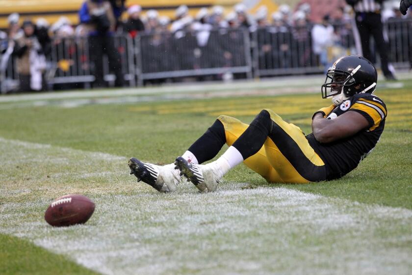 Jerricho Cotchery of the Pittsburgh Steelers holds his shoulder in the end zone during the game against the Cleveland Browns on Sunday.