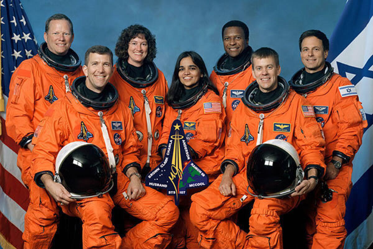 Front from left are astronauts Rick D. Husband, mission commander; Kalpana Chawla, mission specialist; and William C. McCool, pilot. Rear from left are: David M. Brown, Laurel B. Clark, and Michael P. Anderson, all mission specialists; and Ilan Ramon, payload specialist, representing the Israeli Space Agency.