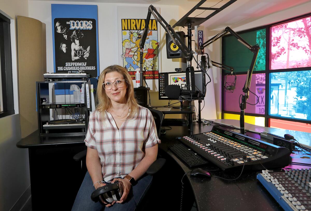 New KXFM 104.7 general manager Alyssa Hayek in the station studio in Laguna Beach on Tuesday.