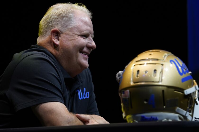 UCLA coach Chip Kelly smiles during the Pac-12 Conference NCAA college football media day Friday, July 29, 2022, in Los Angeles. (AP Photo/Damian Dovarganes)