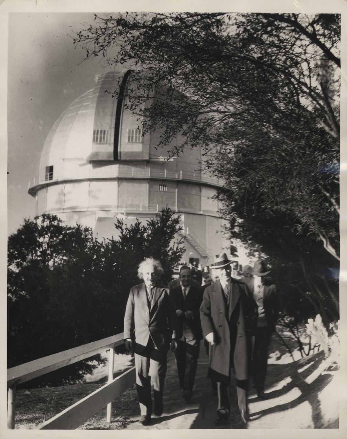 Albert Einstein, Walther Mayer and William W. Campbell at the telescope dome in 1931.