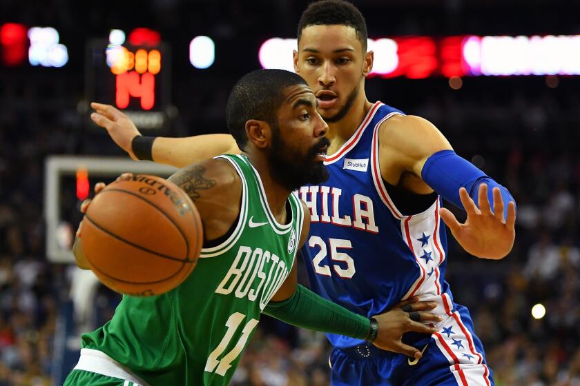 LONDON, ENGLAND - JANUARY 11: Kyrie Irving #11 of the Boston Celtics holds off Ben Simmons #25 of the Philadelphia 76ers during the NBA game between Boston Celtics and Philadelphia 76ers at The O2 Arena on January 11, 2018 in London, England. (Photo by Dan Mullan/Getty Images) ** OUTS - ELSENT, FPG, CM - OUTS * NM, PH, VA if sourced by CT, LA or MoD **