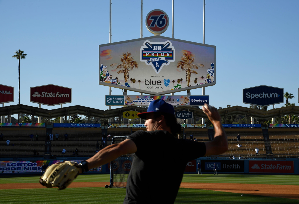 Texas Rangers assistant coach Alex Burg throws on the field at Dodger Stadium before the eighth annual LGBTQ+ Night.