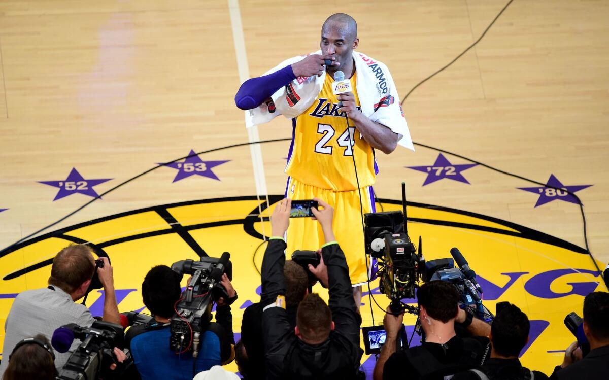 Lakers superstar Kobe Bryant addresses fans after his final NBA game on Wednesday night.