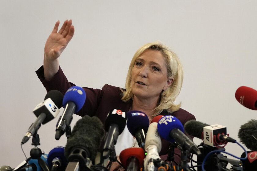 French far-right leader Marine Le Pen gestures during a press conference Tuesday, April 12, 2022 in Vernon, west of Paris. The thought of an extreme-right leader standing at the helm of the European Union would be abhorrent to most in the 27-nation bloc. But if Emmanuel Macron falters in the April 24 French presidential elections, it might be two weeks away. (AP Photo/Francois Mori)