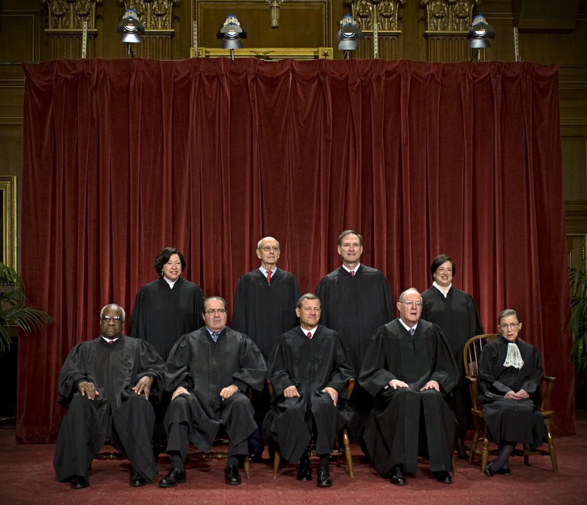 The nine members of the Supreme Court pose for a group photograph in 2010.