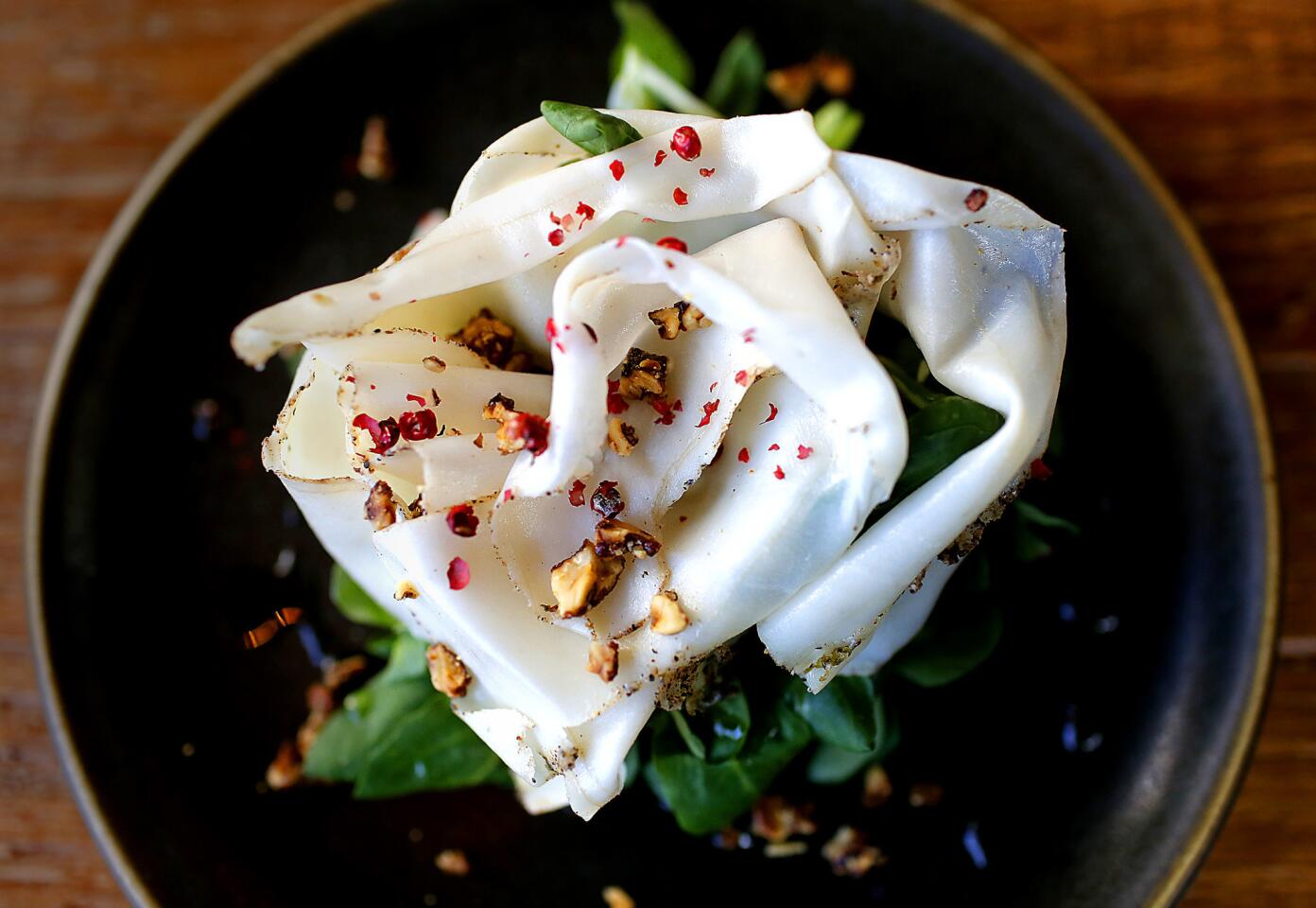 The lardo al pepe at Officine Brera is an artful composition of cured pork back fat atop arugula, dressed with honey, peppercorns and walnuts. The restaurant is a new endeavor from Matteo Ferdinandi and chef Angelo Auriana.