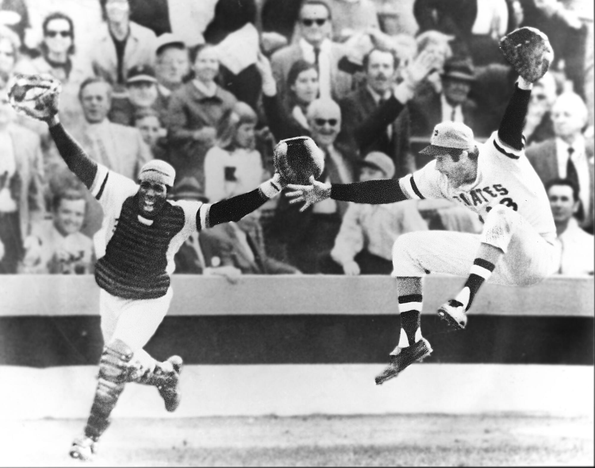 Pirates pitcher Steve Blass and catcher Manny Sanguillen celebrate after winning the 1971 World Series.