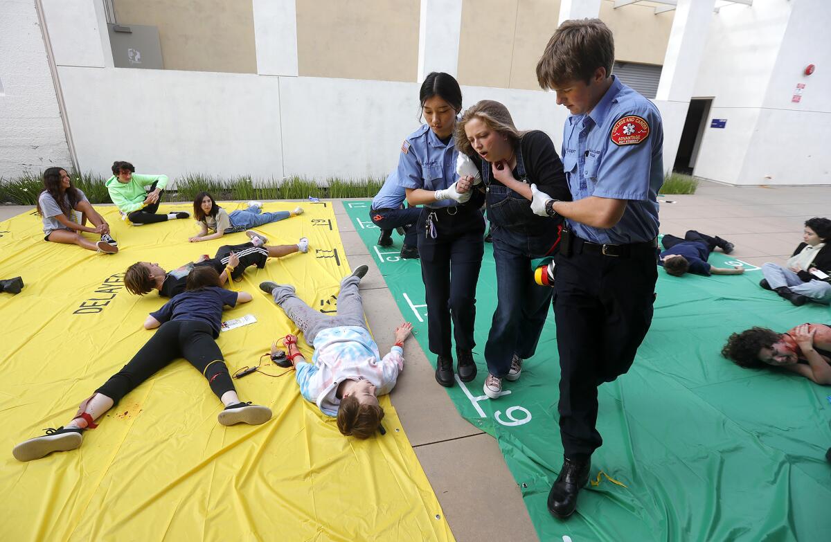 Laguna Beach High EMT students manage a simulated triage situation at Laguna Beach High. 