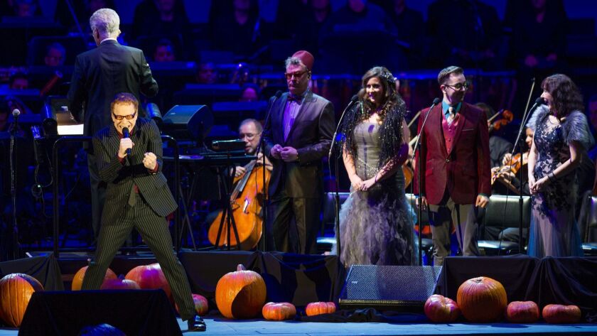 Danny Elfman sings with the chorus during a "Nightmare Before Christmas" concert at the Hollywood Bowl on Oct. 31, 2015.