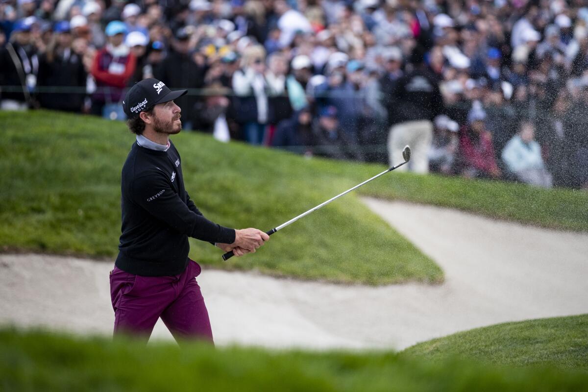 Sam Ryder hits from the bunker on the 18th hole during final round of the Farmers Insurance Open at Torrey Pines.