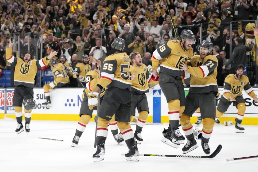Members of the Vegas Golden Knights celebrate after defeating the Florida Panthers 9-3 to win the Stanley Cup.