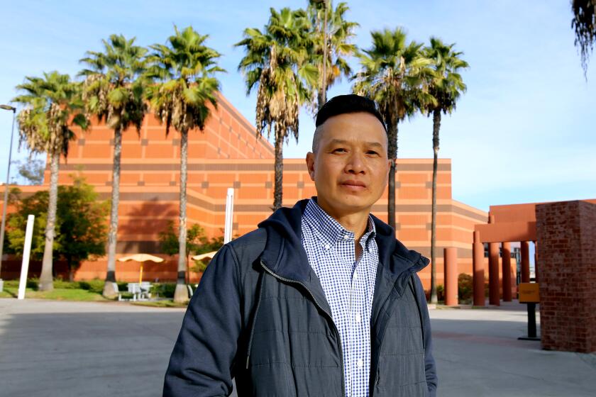 Tin Nguyen, 48 of Los Angeles, is a Vietnamese refugee who was convicted of murder and spent 23 years in California prisons, shown at Cal State Los Angeles on Monday, Dec. 15, 2020. Nguyen, who was released from prison in 2019, began college in 2016 while in prison and is still enrolled.