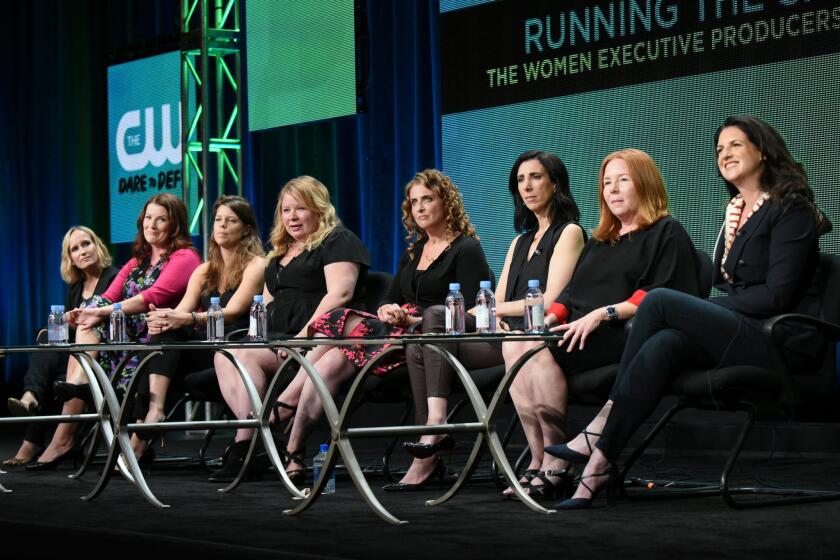 From left, CW executive producers, Wendy Mericle ("Arrow"), Diane Ruggiero-Wright ("iZombie), Caroline Dries ("The Vampire Diaries"), Julie Plec ("The Vampire Diaries" and "The Originals"), Jennie Snyder Urman ("Jane the Virgin"), Aline Brosh McKenna ("Crazy Ex-Girlfriend), Laurie McCarthy ("Reign") and Gabrielle Stanton ("The Flash") participate in the "Running the Show: The Women Executive Producers of The CW" panel at The CW Summer TCA Tour at the Beverly Hilton Hotel on Aug. 11, 2015.