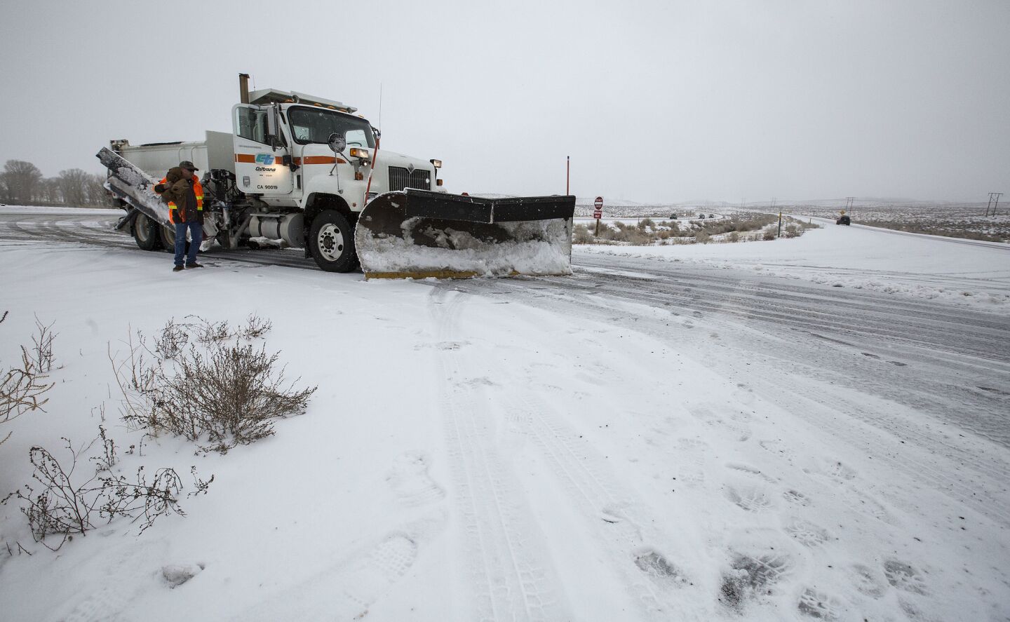 Caltrans snowplow operator Mike Morgan prepares to turn his plow around after making loops on the 395 between Bishop and Tom's Place, a route he drives 12 hours a day clearing heavy snow in the Eastern Sierra.