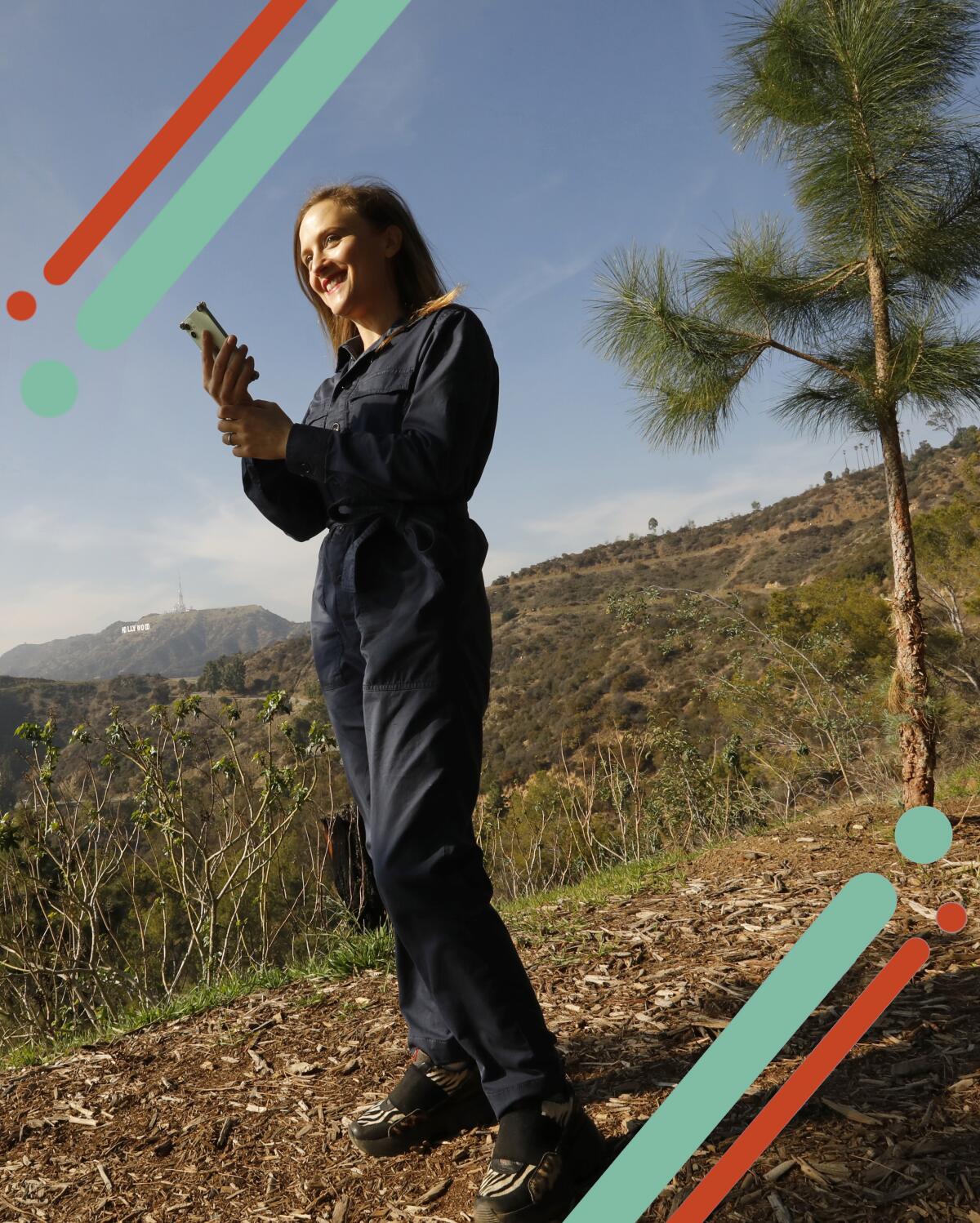 Sound artist Ellen Reid uses her smartphone to listen to music at Griffith Park