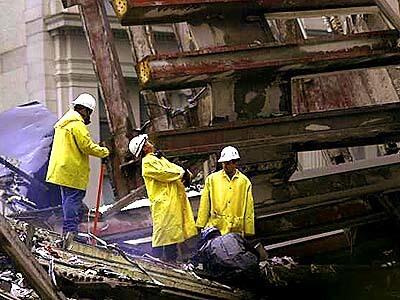 Rescue workers examine wreckage