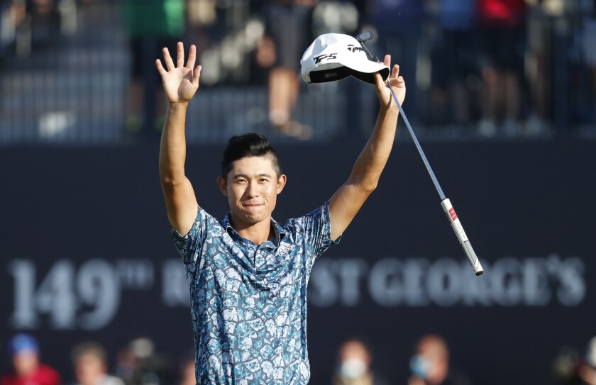 Collin Morikawa celebrates on the 18th green after winning The British Open.