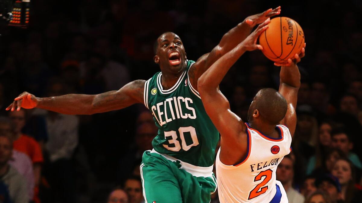 Boston Celtics power forward Brandon Bass, left, tries to block a shot by New York Knicks point guard Raymond Felton during a playoff game in May 2013.