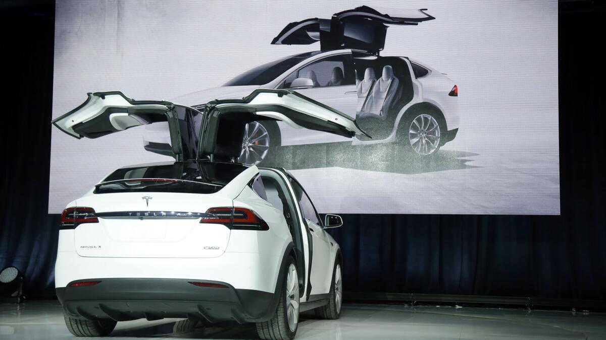 The Model X car is unveiled at the company's headquarters Sept. 29 in Fremont, Calif.