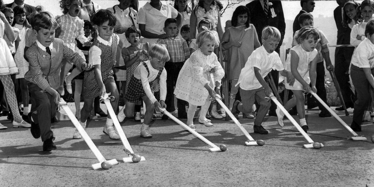 March 30, 1969: Children whose mothers are members of Pinafores of the League for Crippled Children take part in an Easter egg roll at Brookside Golf Club.
