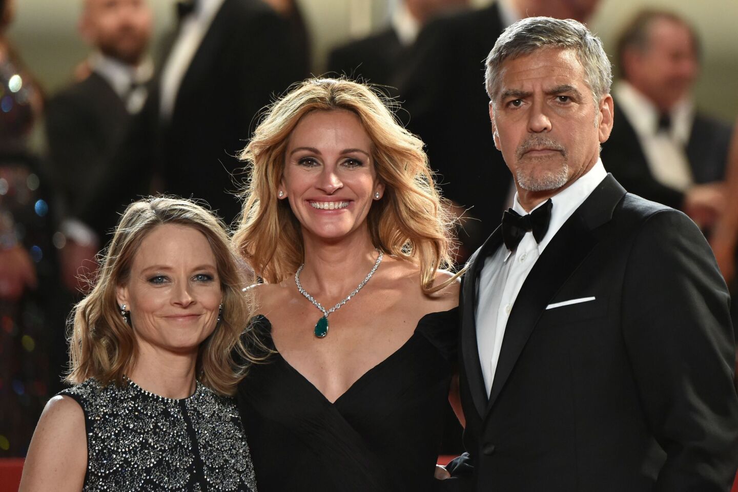 From left: Director Jodie Foster, actress Julia Roberts, and actor George Clooney pose together before leaving the Festival Palace after the screening of their new film"Money Monster" at the Cannes Film Festival on Thursday night.