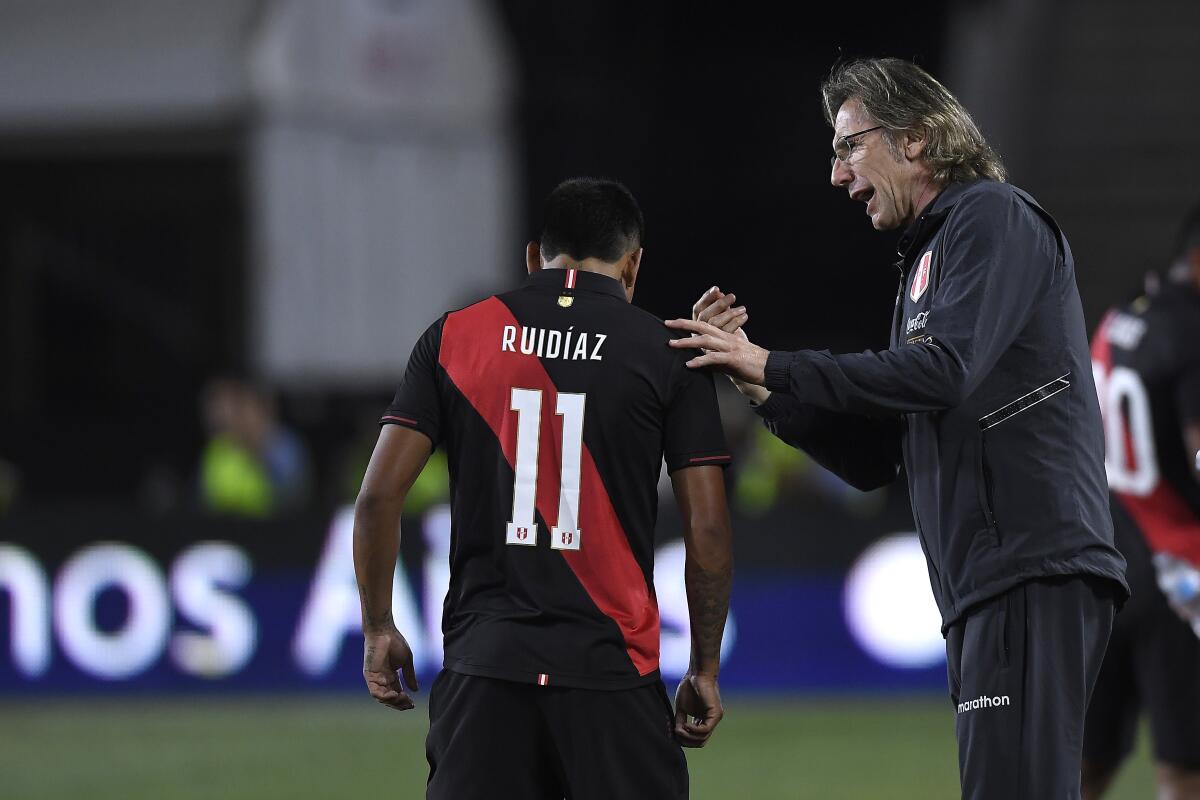 LOS ANGELES, CALIFORNIA - SEPTEMBER 10: Peru head coach Ricardo Gareca talks with Raúl Ruidíaz #11 of Peru in the 2019 International Champions Cup match against Brazil on September 10, 2019 in Los Angeles, California. (Photo by Kevork Djansezian/Getty Images) ** OUTS - ELSENT, FPG, CM - OUTS * NM, PH, VA if sourced by CT, LA or MoD **