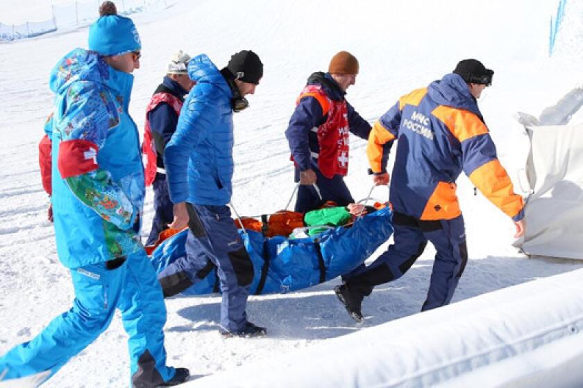 Snowboarder Marika Enne of Finaldn is carried off on a stretcher after a crash landing on the final jump of the slopestyle course at the Rosa Khutor Extreme Park prior to the Sochi 2014 Winter Olympics.