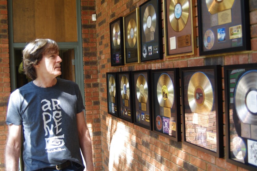 Memphis musician Jody Stephens surveys some of the gold and platinum awards for records made at Ardent Studios in Memphis. As a member of the early indie rock band Big Star, he recorded there in the early 1970s, and also recorded the debut album by his latest band, Those Pretty Wrongs, at Ardent.