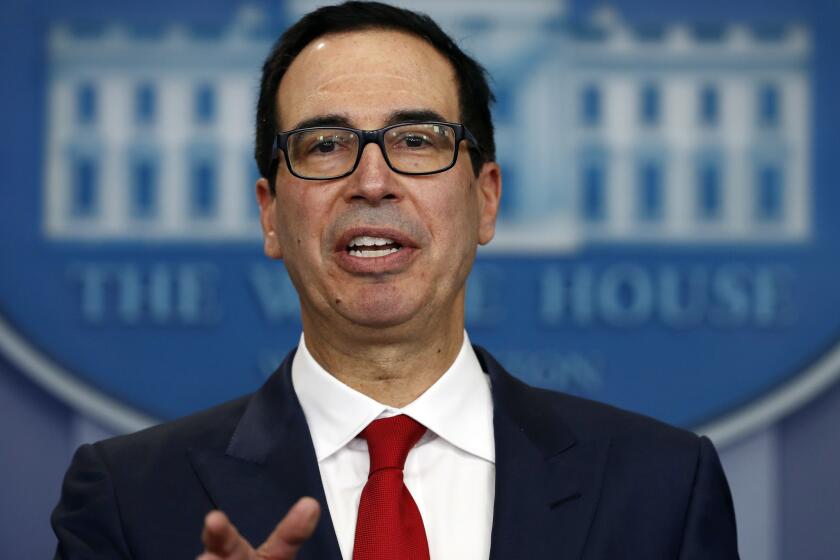 FILE - In this Friday, Aug. 25, 2017, file photo, Treasury Secretary Steven Mnuchin speaks during a news briefing at the White House in Washington. Mnuchin is calling on Congress to combine a $7.9 billion disaster relief package for Hurricane Harvey with a contentious increase in the nation's debt limit. He says itâs time to "put politics aside" so storm victims can get the help they need.â Trump plans to meet with congressional leaders from both parties this week. (AP Photo/Carolyn Kaster, File)