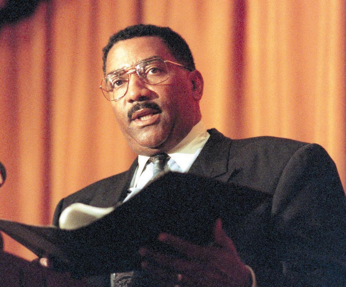 Former LAPD Chief Willie L. Williams, pictured reading a prepared statement in connection with the controversy over his leadership, has died. He was 72.