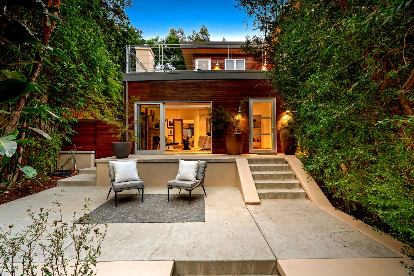 A series of patios fill the tiered courtyard of Josh Lucas' home.