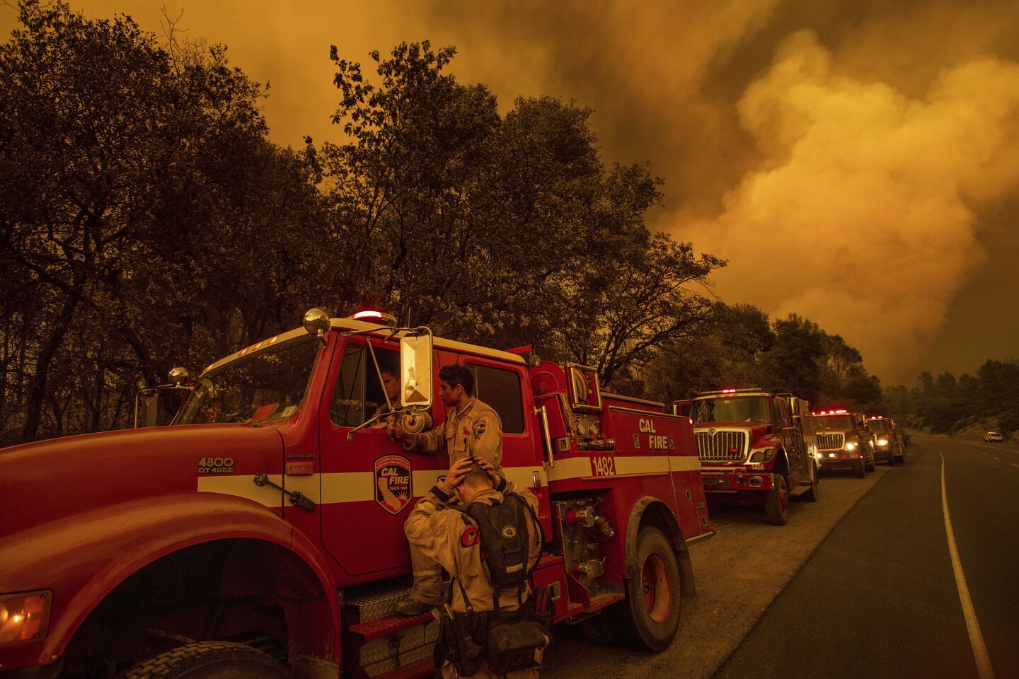 Firefighters regroup while battling the Carr cire in Shasta County on July 26.