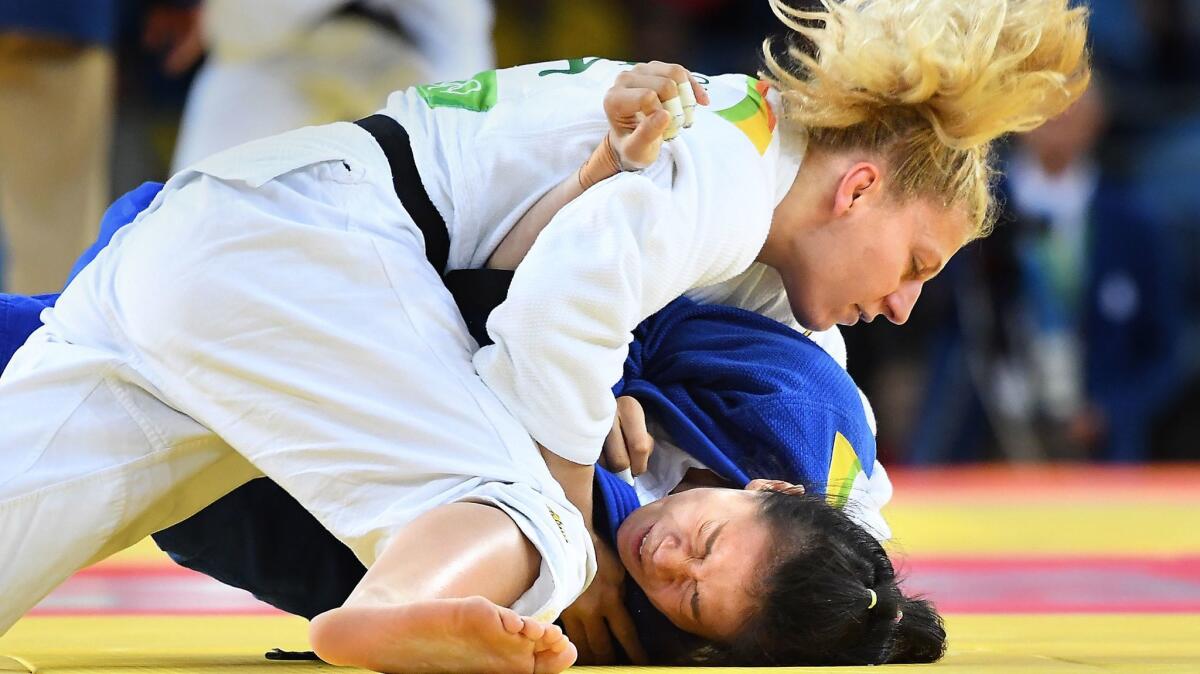 Kayla Harrison takes down China's Zhehui Zhang at the Rio de Janeiro 2016 Olympics on Aug. 11.