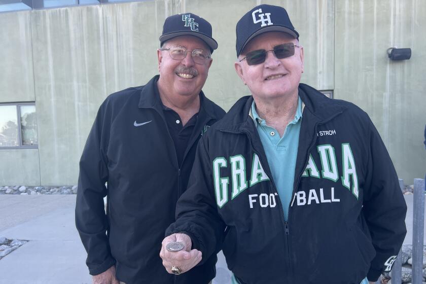 Former Granada Hills football and baseball coach Darryl Stroh (right) 