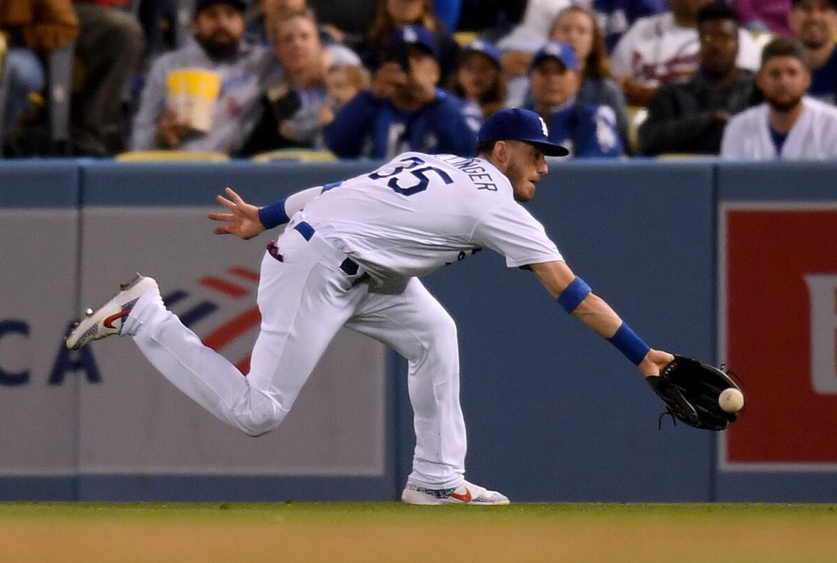 Dodgers right fielder Cody Bellinger makes a running catch.