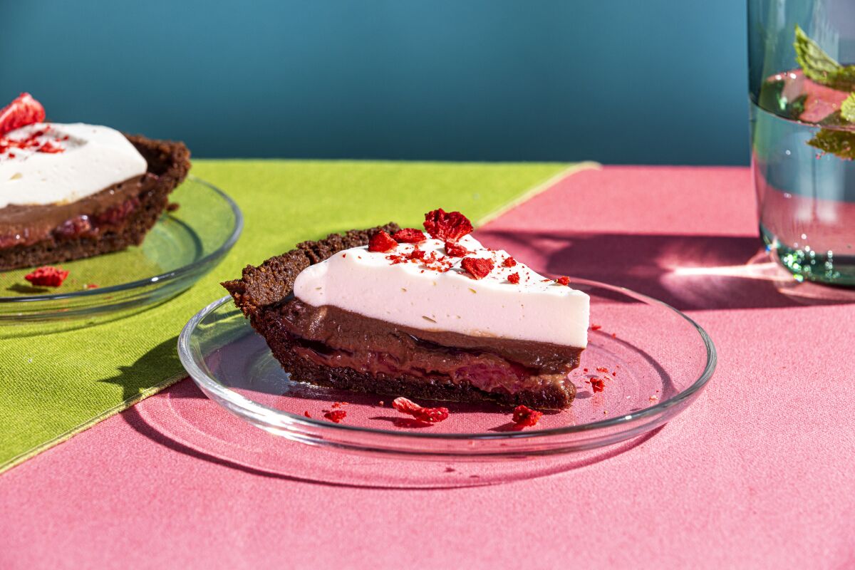 Roasted strawberries collapse into a light chocolate crust covered with cold cream in a spin on black forest pie.