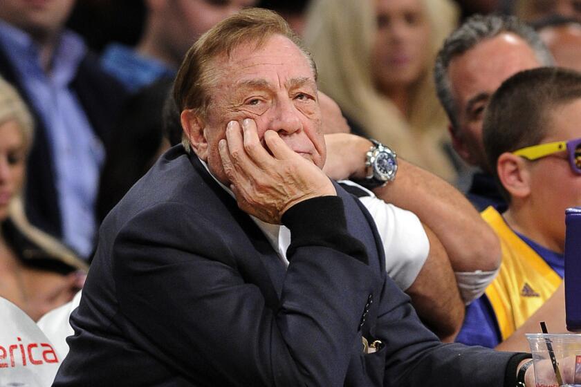 Clippers owner Donald Sterling watches a game against the Lakers in 2011. The daughter of a former housing tenant who filed a discrimination lawsuit against Sterling in 2003 says she supports the NBA's decision to ban Sterling for life.